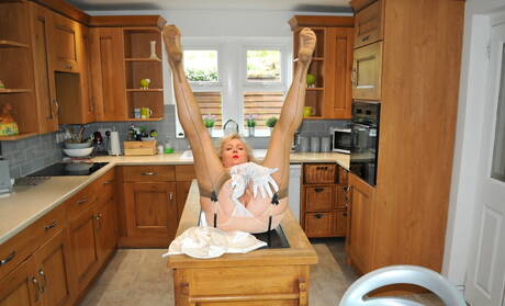 Nylon Sue invite you to explore xxx pictures featuring Nylon Sue in porn with dildo scene